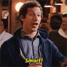 a smart guy pointing on his head
